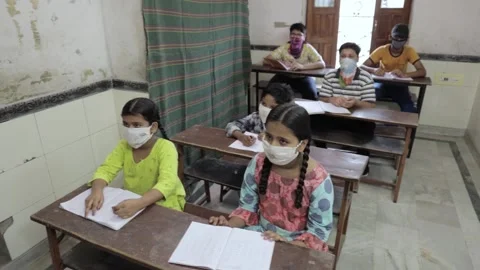 Students Studying In Classroom While Female Teacher Teach On Whiteboard Stock Footage 138131720