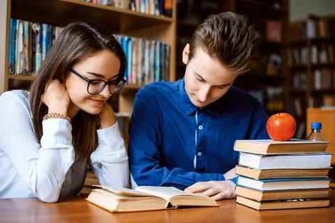 Students studying at the library Stock Photos