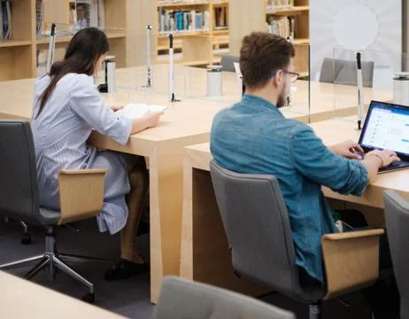 Students studying in a public library Stock Photos