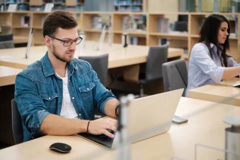 Students studying in a public library Photos