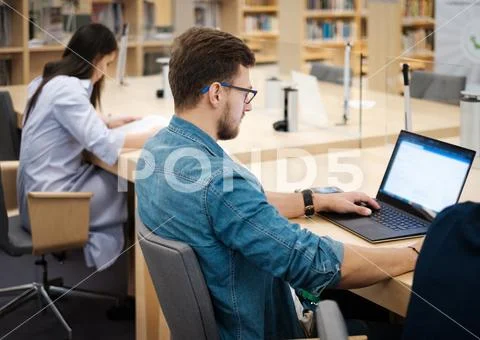 Students Studying In A Public Library