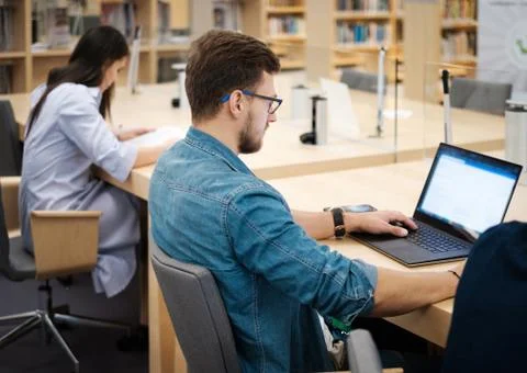 Students studying in a public library Stock Photos