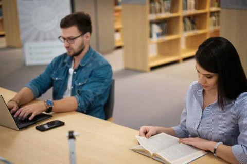 Students studying in a public library Foto stock