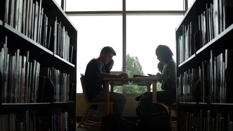 Students studying in a school library Video stock 83399142