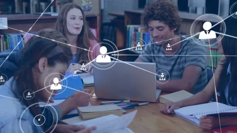 Students studying together in library, laptop node appearing and linking user Video stock 330142724