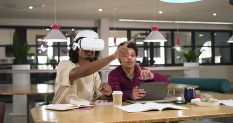 Students studying with VR user putting on white headset, gesturing, tablet Stock Footage 340964441