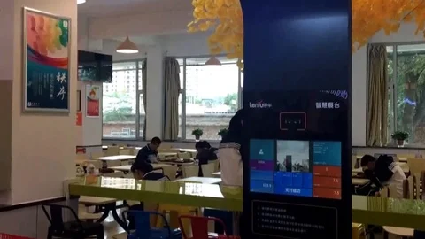 Students swipe faces to pay for meals in high school canteen Stock Footage 106309495