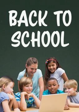 Students at table looking at a computer against green blackboard with back to Stock Photos