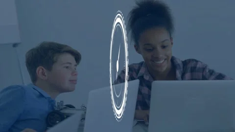 Students at table typing and watching laptops, clock graphic fading in, guiding Stock Footage 335651705