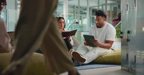 Students, tablet and discussion with book, education and problem solving for Stock Footage 312678641
