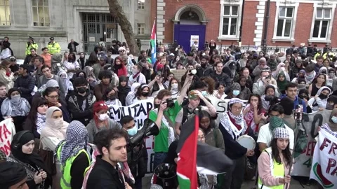 Students take part in an inter-university march for Gaza outside SOAS Universit Stock Footage 318546531