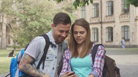 Students take selfies on campus Stock Footage 79674369