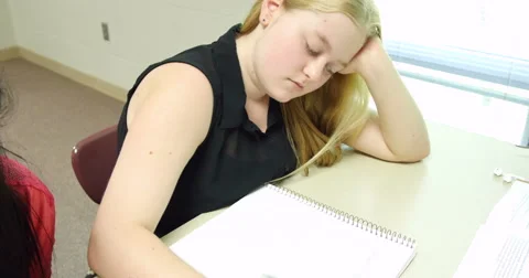Students taking notes and doing their assignments in class. Ultra HD 4K Stock Footage 44524166