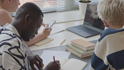 Students Taking Notes and Using Phone on Programming Class Stock Footage 257069526
