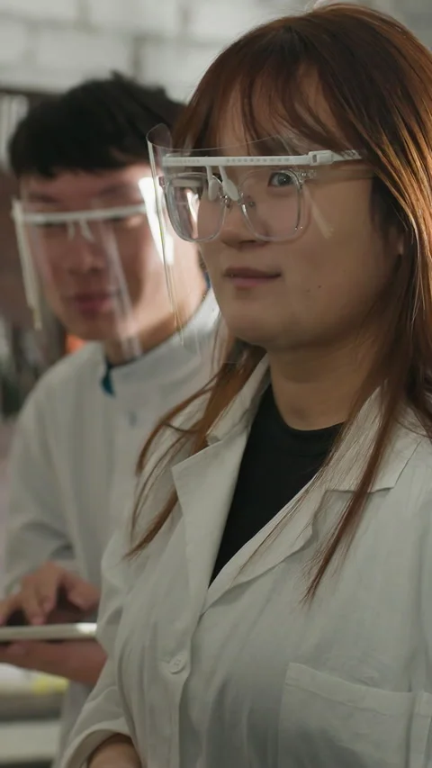 Students Taking Notes on Tablet While Observing Mechanic in Workshop Stock Footage 318201436