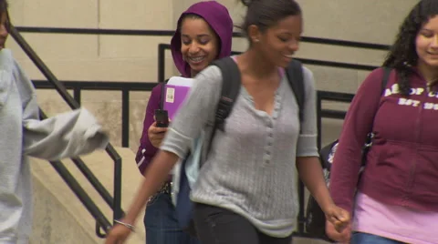 Students talk on steps of Highschool Stock Footage 51778364
