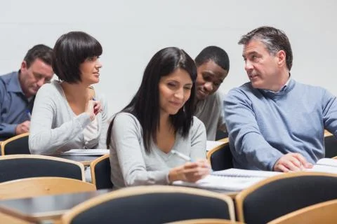 Students talking in lecture Stock Photos