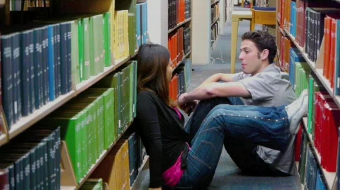 Students Talking in Library Aisle  Stock Footage 707918
