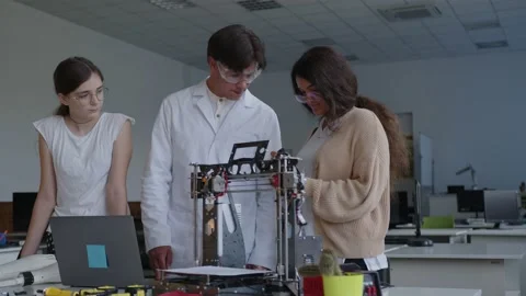 Students teach how to connect all the details of the 3D printed machine Video stock 157636329