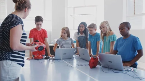 Students With Teacher In After School Computer Coding Class Learning To Program Stock Footage 111932744