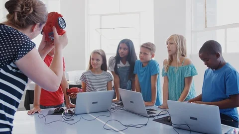 Students With Teacher In After School Computer Coding Class Learning To Program Stock Footage 111932754