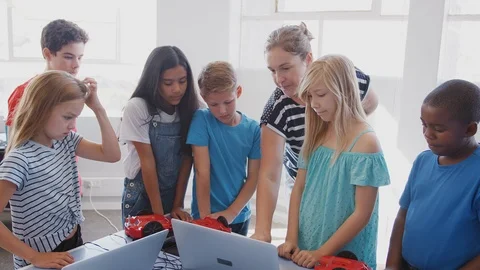 Students With Teacher In After School Computer Coding Class Learning To Program Stock Footage 111932758