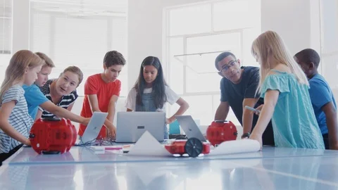 Students With Teachers In After School Computer Coding Class Learning To Program Stock Footage 111932895
