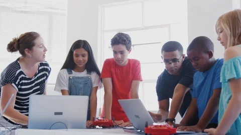 Students With Teachers In After School Computer Coding Class Learning To Program Stock Footage 111933057