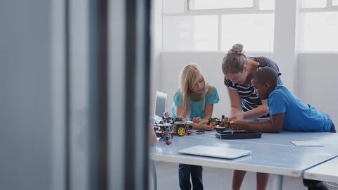 Students With Teachers In After School Computer Coding Class Learning To Program Stock Footage 111933283