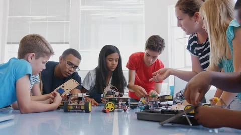 Students With Teachers In After School Computer Coding Class Learning To Program Stock Footage 111933384