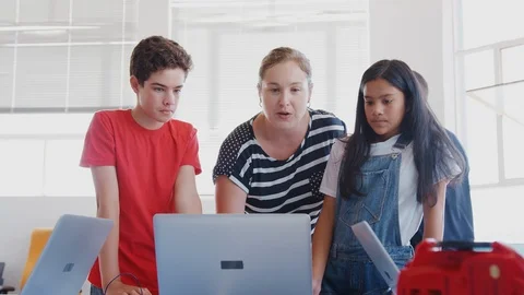Students With Teachers In After School Computer Coding Class Learning To Program Stock Footage 111972866