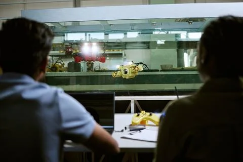 Students Testing Underwater Drone in Laboratory Tank Stock Photos
