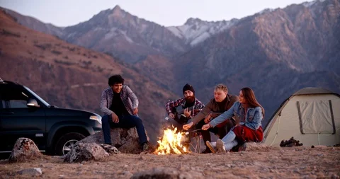 Students on a trip - four hipster multiethnic friends spending their time Stock Footage 129339666