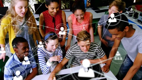 Students typing code in computer lab activating animated network icons showing Stock Footage 316186271