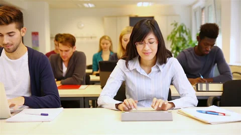 Students typing on tablet computer and laptop Video stock 33468710