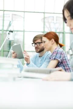 Students in a university library using digital tablet Stock Photos