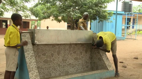 STUDENTS UNLOCK THE SECURITY COVER OVER WATER FAUCETS Stock Footage 60115780