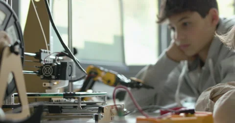 Students using a 3D printer in the lab Stock Footage 168337289