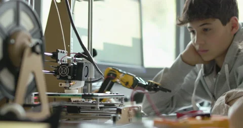 Students using a 3D printer in the lab Stock Footage 168337504