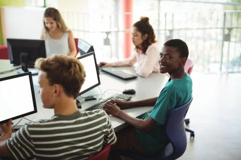 Students using computer in classroom Stock Photos
