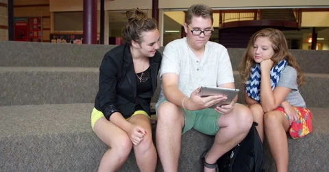Students using an iPad tablet in a school. Ultra HD 4K Stock Footage 45575105