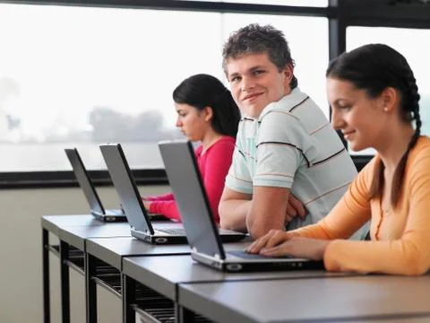 Students Using Laptops In Computer Class Stock Photos