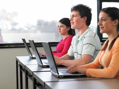 Students Using Laptops In Computer Class 写真素材