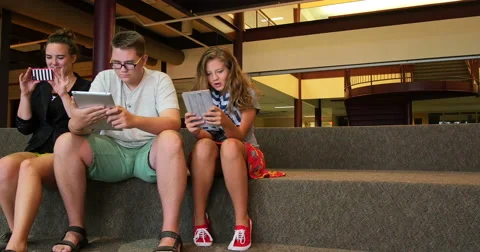 Students using newer technology in a school. Ultra HD 4K Stock Footage 45652642