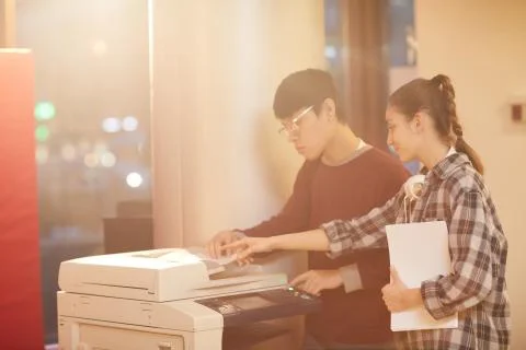 Students using printer Foto stock