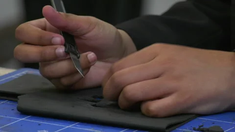 Students using a scalpel to cut foam Stock-Footage 239652692