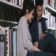 Students Using Smartphone In Library Stock Footage