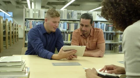 Students using tablet in library Video stock 67365021
