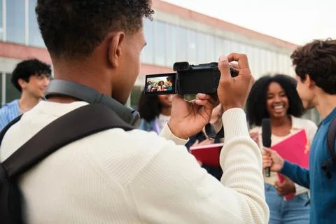Students vlogging interview on college campus for content creation Stock Photos