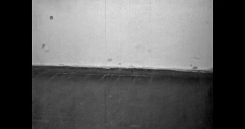 Students walk along the school corridor. Wooden floor, white wall. Walking legs Stock Footage 255559108